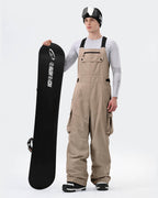 Men wearing Khaki 3-layer baggy ski bib pants winter outdoor shot
