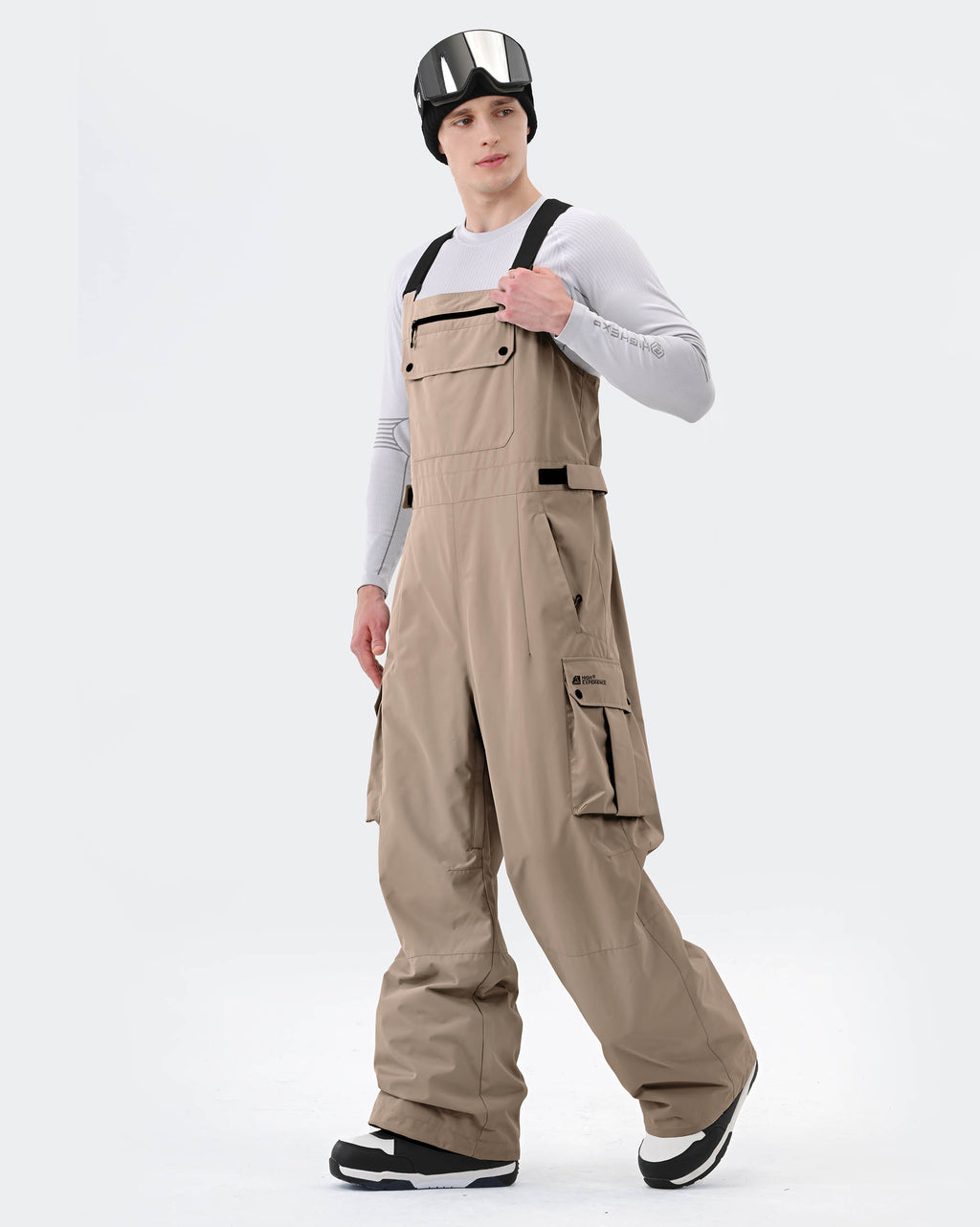 Khaki ski bib pants adjustable suspender and waterproof zipper detail
