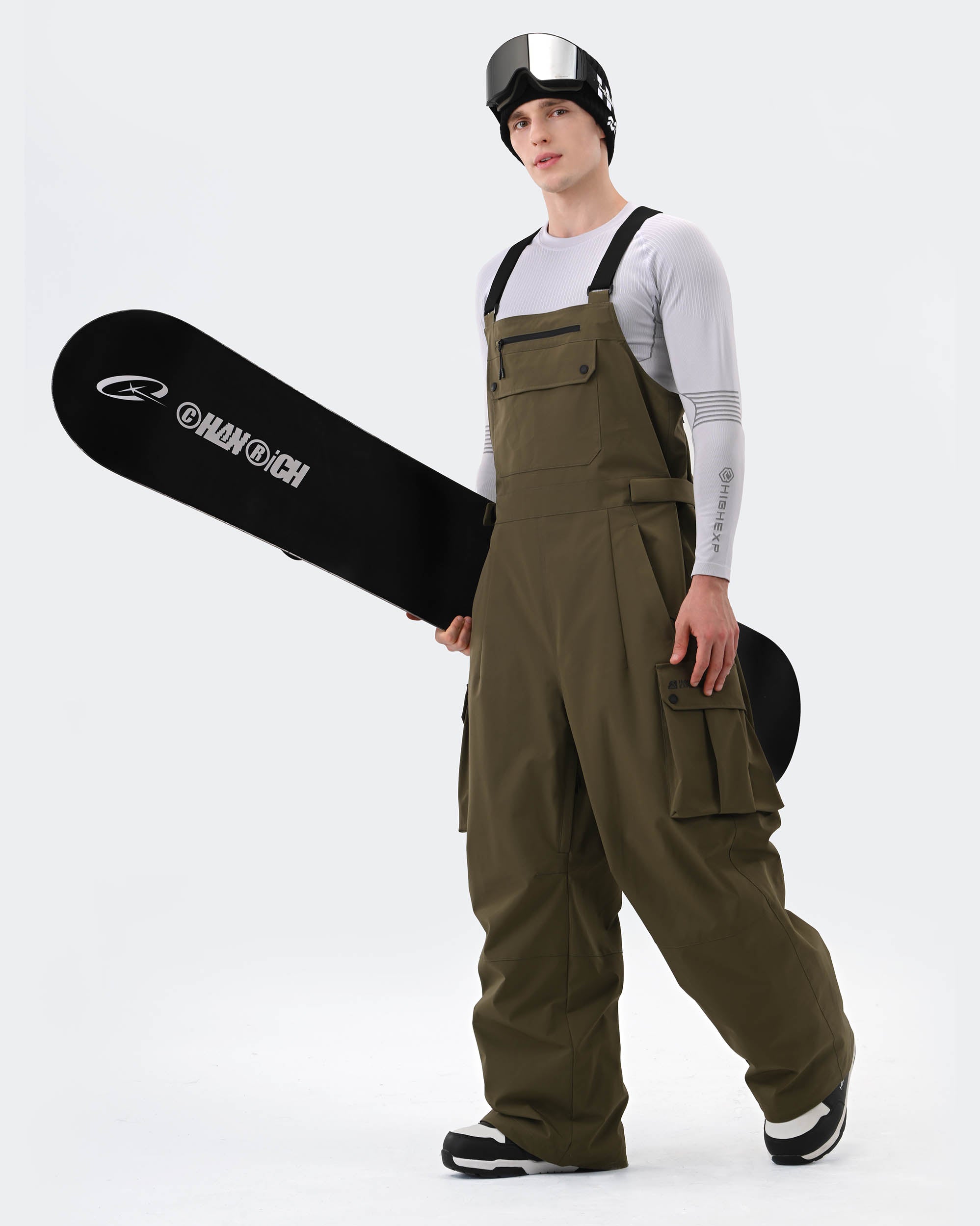 Army Green ski bib pants adjustable suspender and zippered pocket detail
