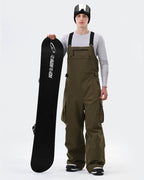 Men wearing Army Green 3-layer baggy ski bib pants on mountain
