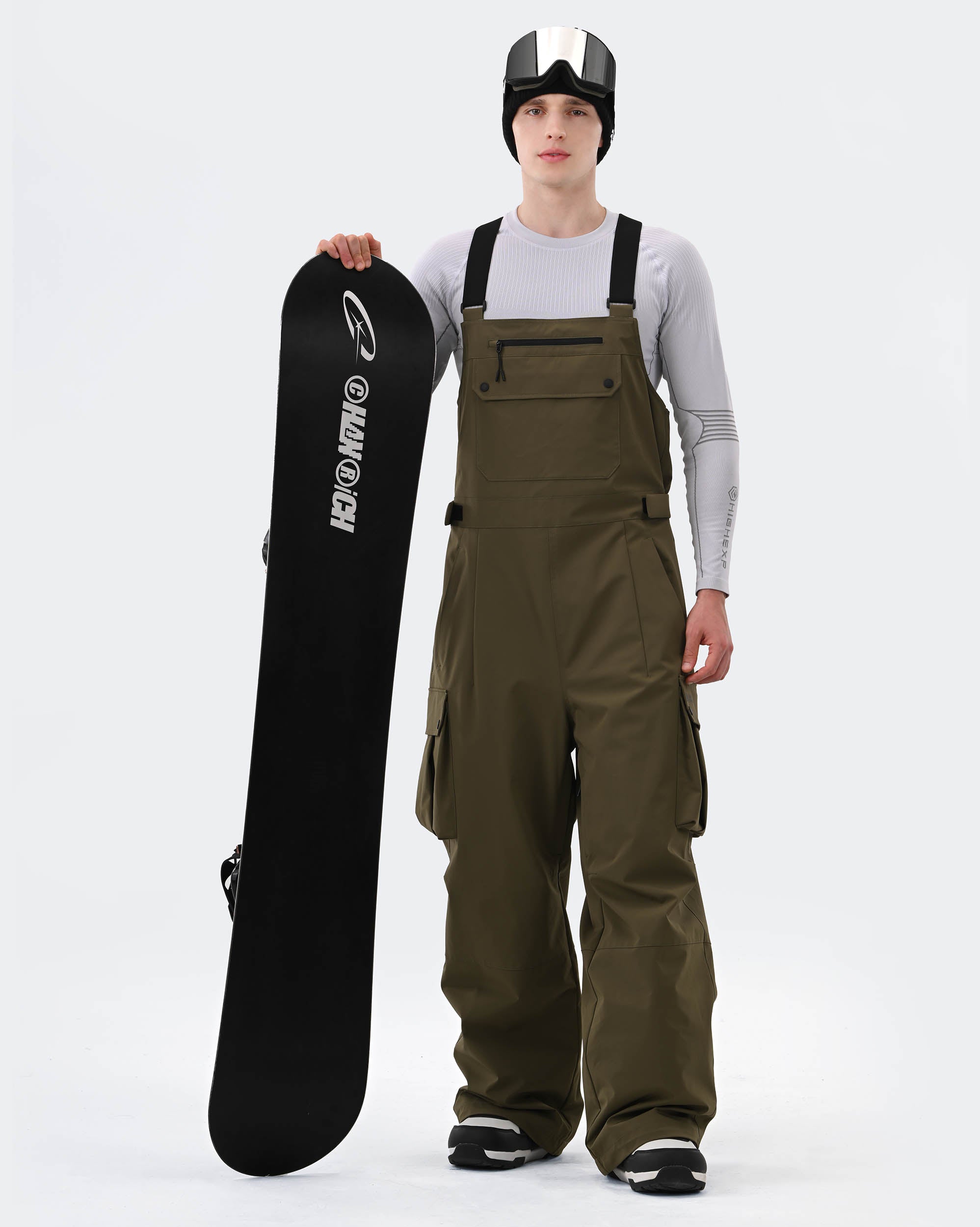 Men wearing Army Green 3-layer baggy ski bib pants on mountain
