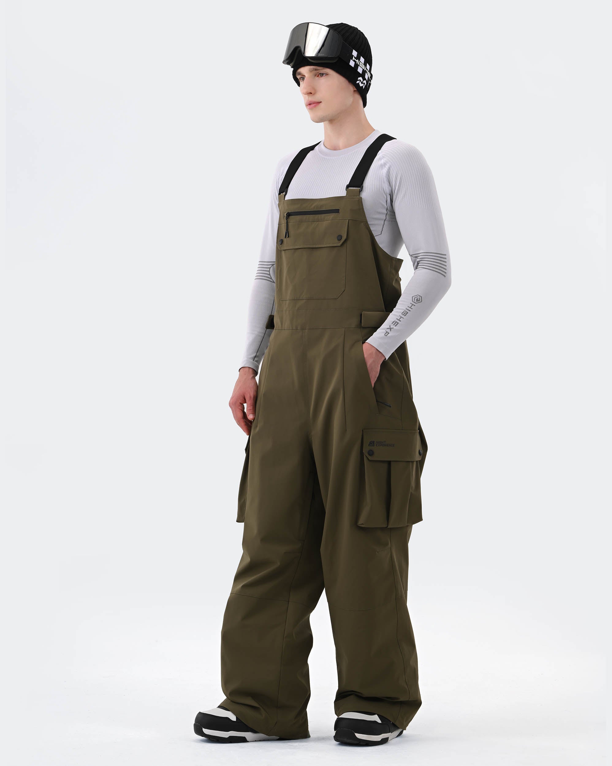 Army Green baggy ski bib pants side view showing relaxed fit and suspenders
