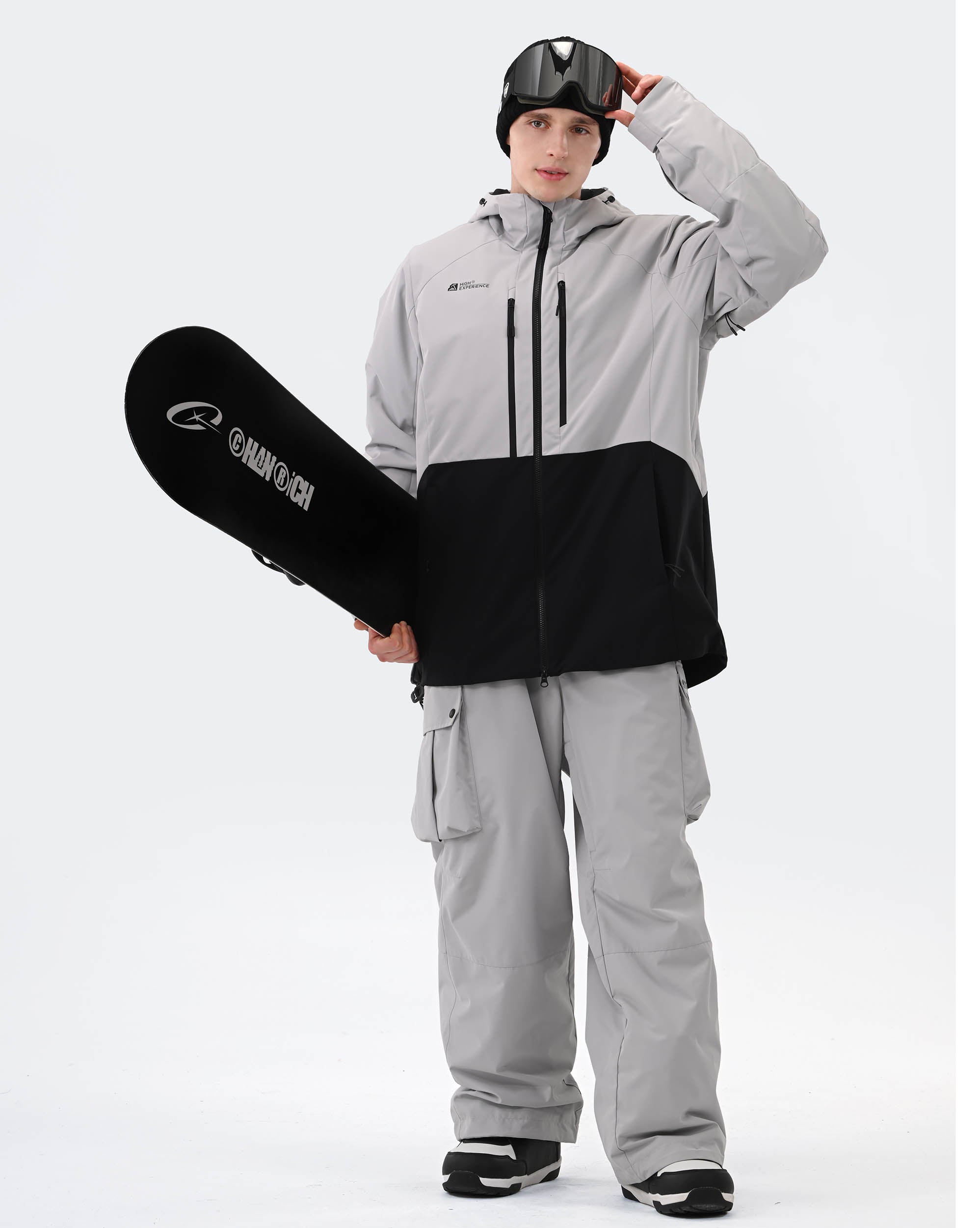 Gray ski jacket goggle pocket and cuff lift ticket pocket detail
