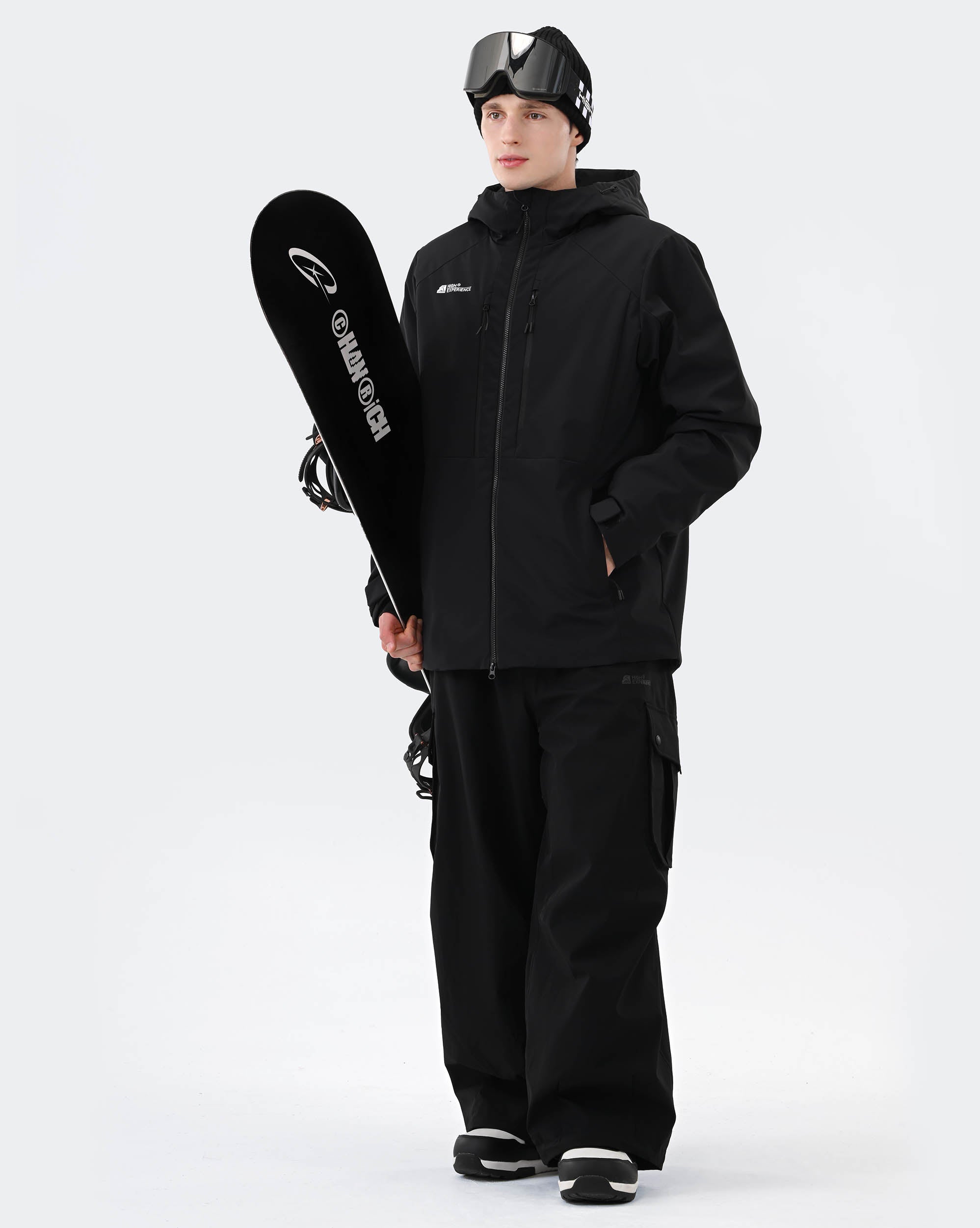 Men wearing Black 3-layer baggy ski jacket on mountain
