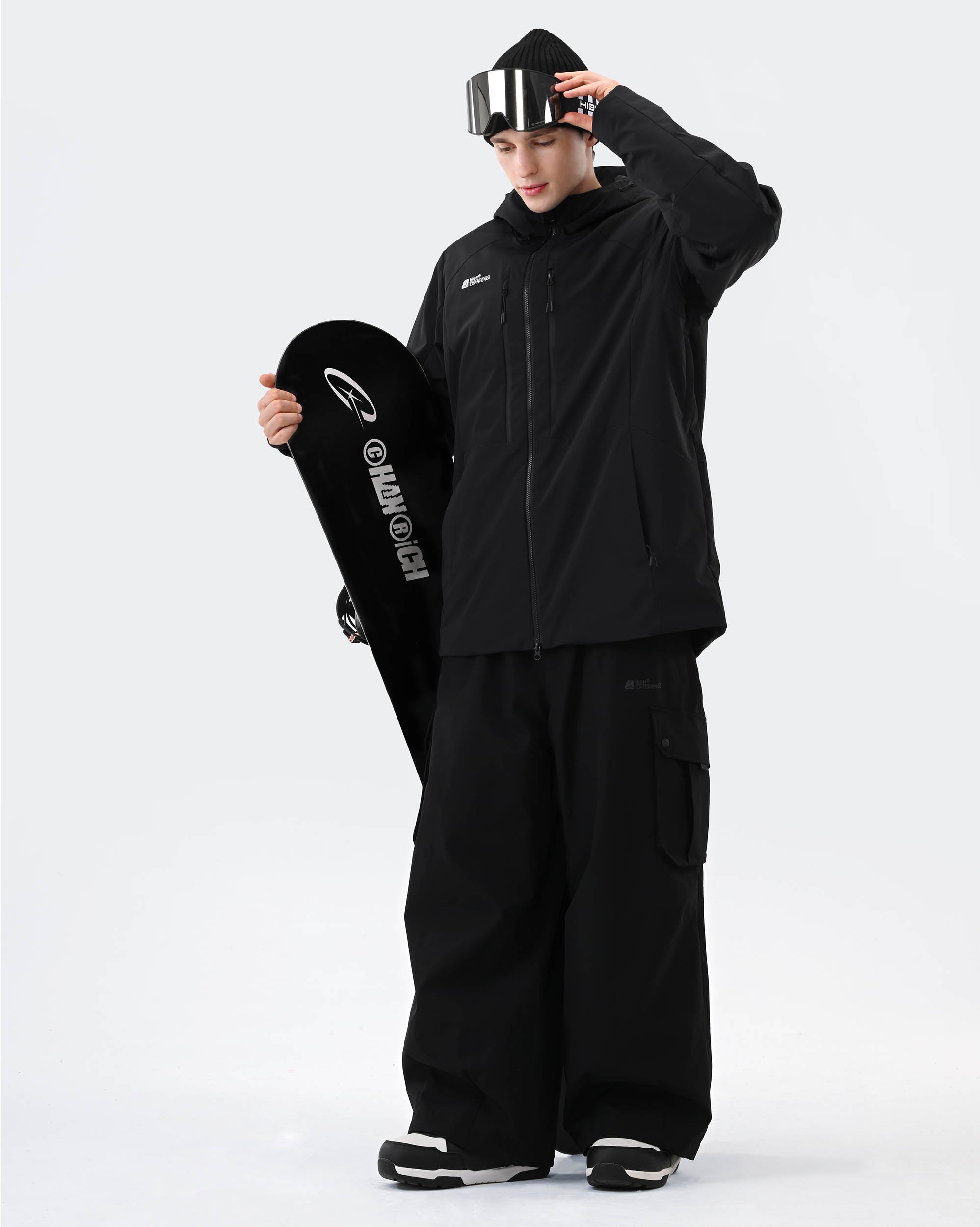 Black baggy ski jacket side view showing relaxed oversized silhouette
