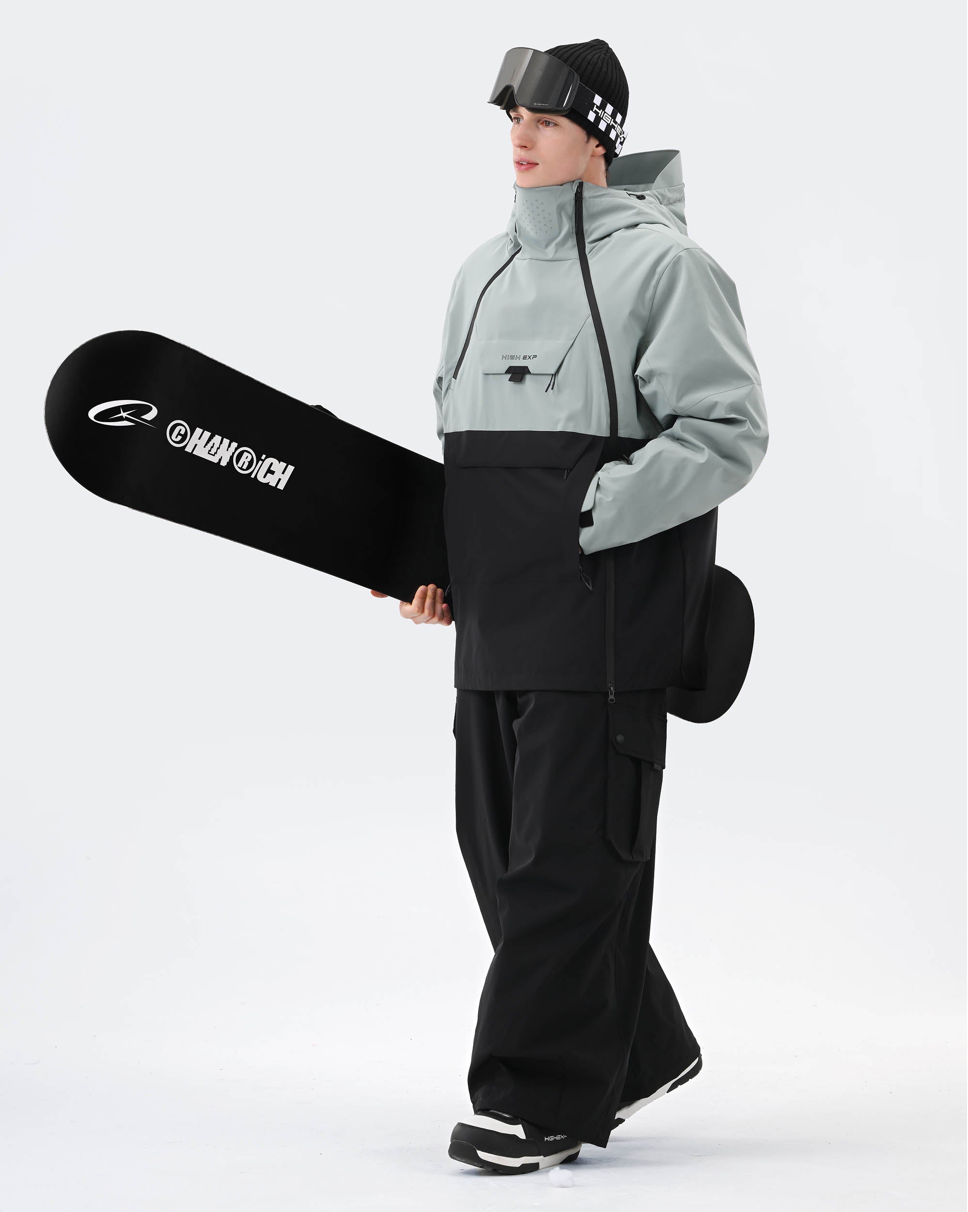 Greenish Blue Black ski jacket taped seam and snow skirt detail
