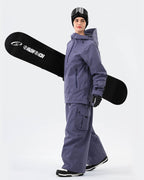 Women wearing Purple 3L ski jacket with RECCO reflector backcountry adventure
