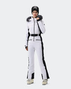 Women wearing Red and Black one-piece insulated ski suit powder day
