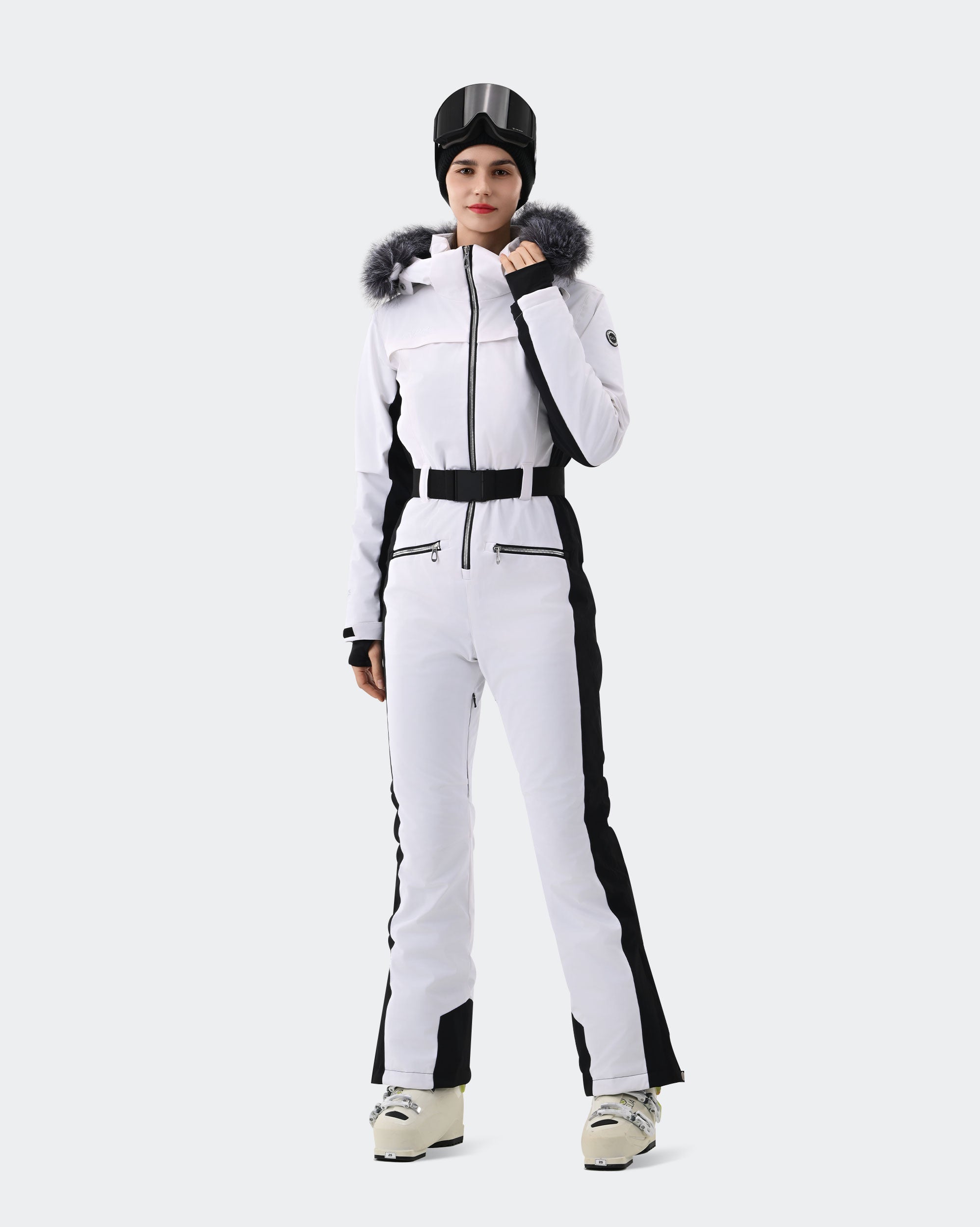 Women wearing Red and Black one-piece insulated ski suit powder day
