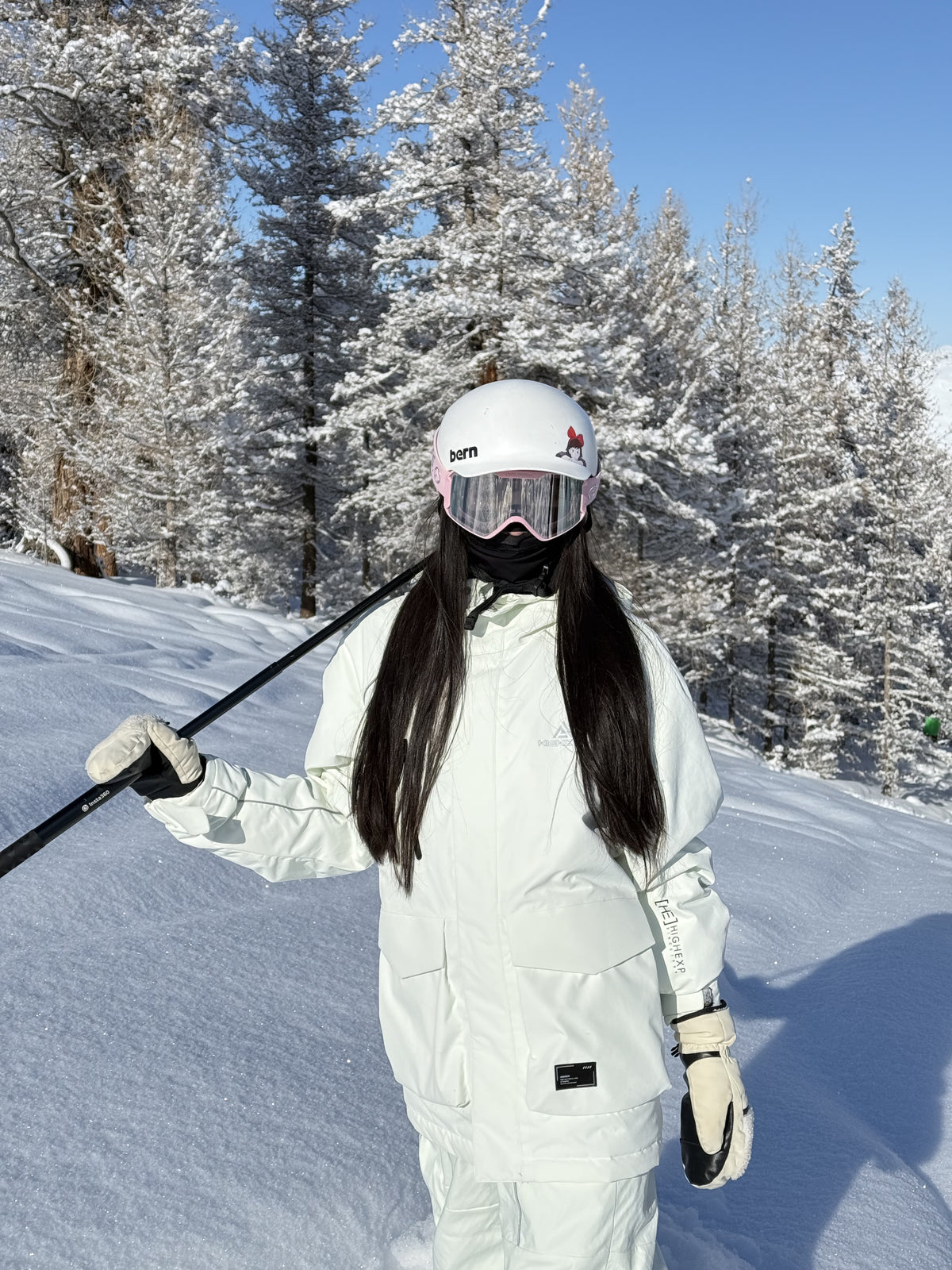 HIGH EXPERIENCE customer wearing ski gear on the mountain