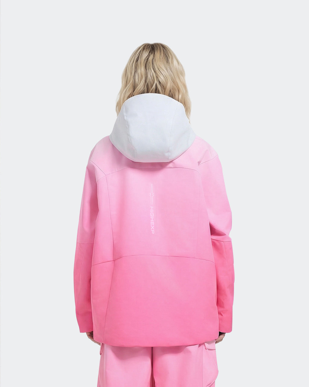 Pink baggy waterproof ski jacket back view – women's snowboard outerwear
