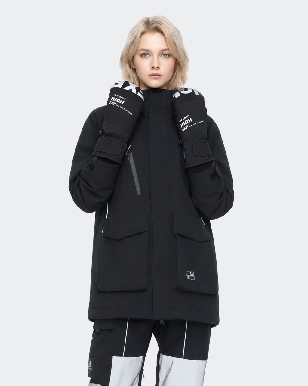 High Experience Black Ski Gloves - Female Model Wearing Black Ski Jacket for Winter Sports