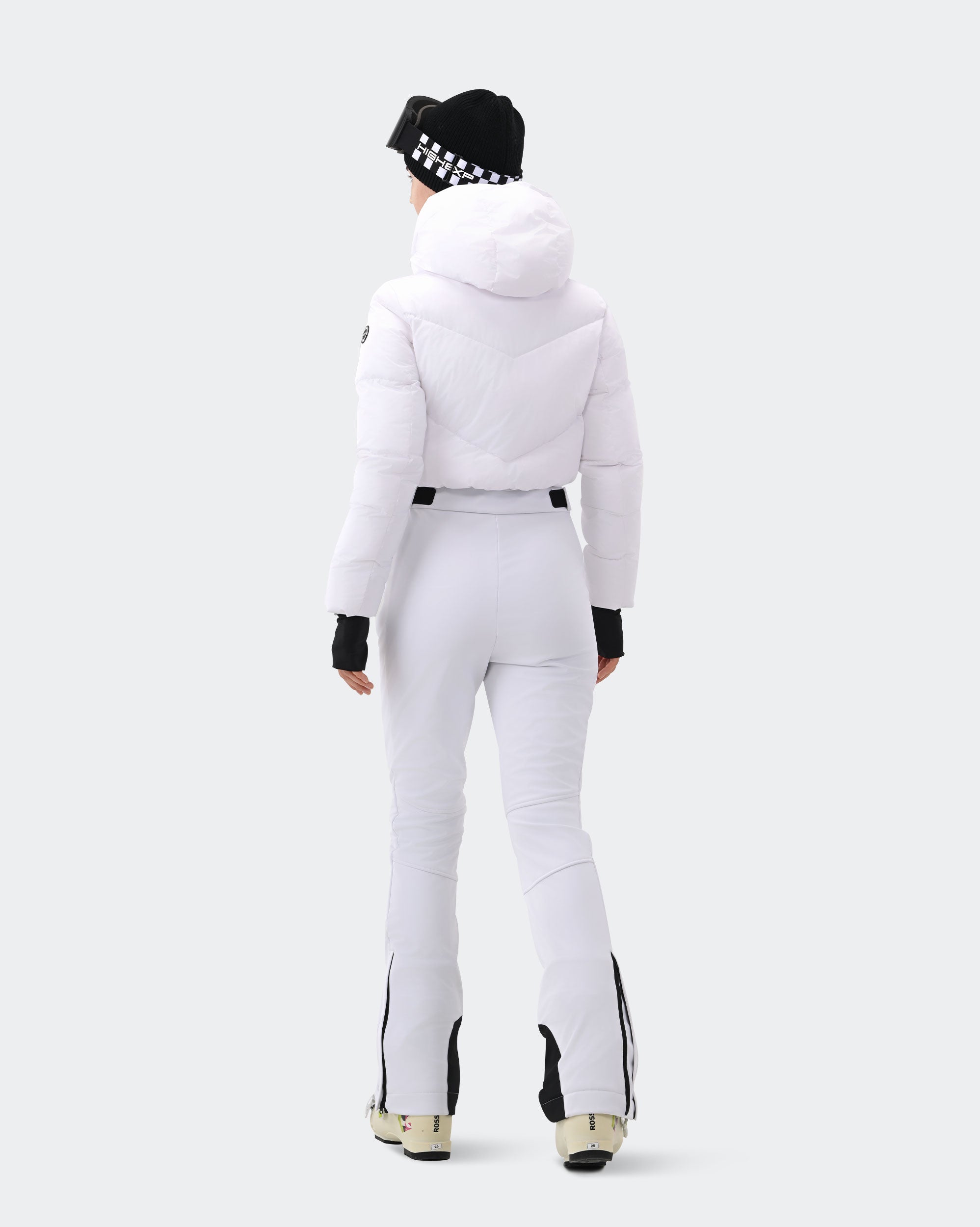 Women's White insulated snowsuit side view showing slim fit silhouette
