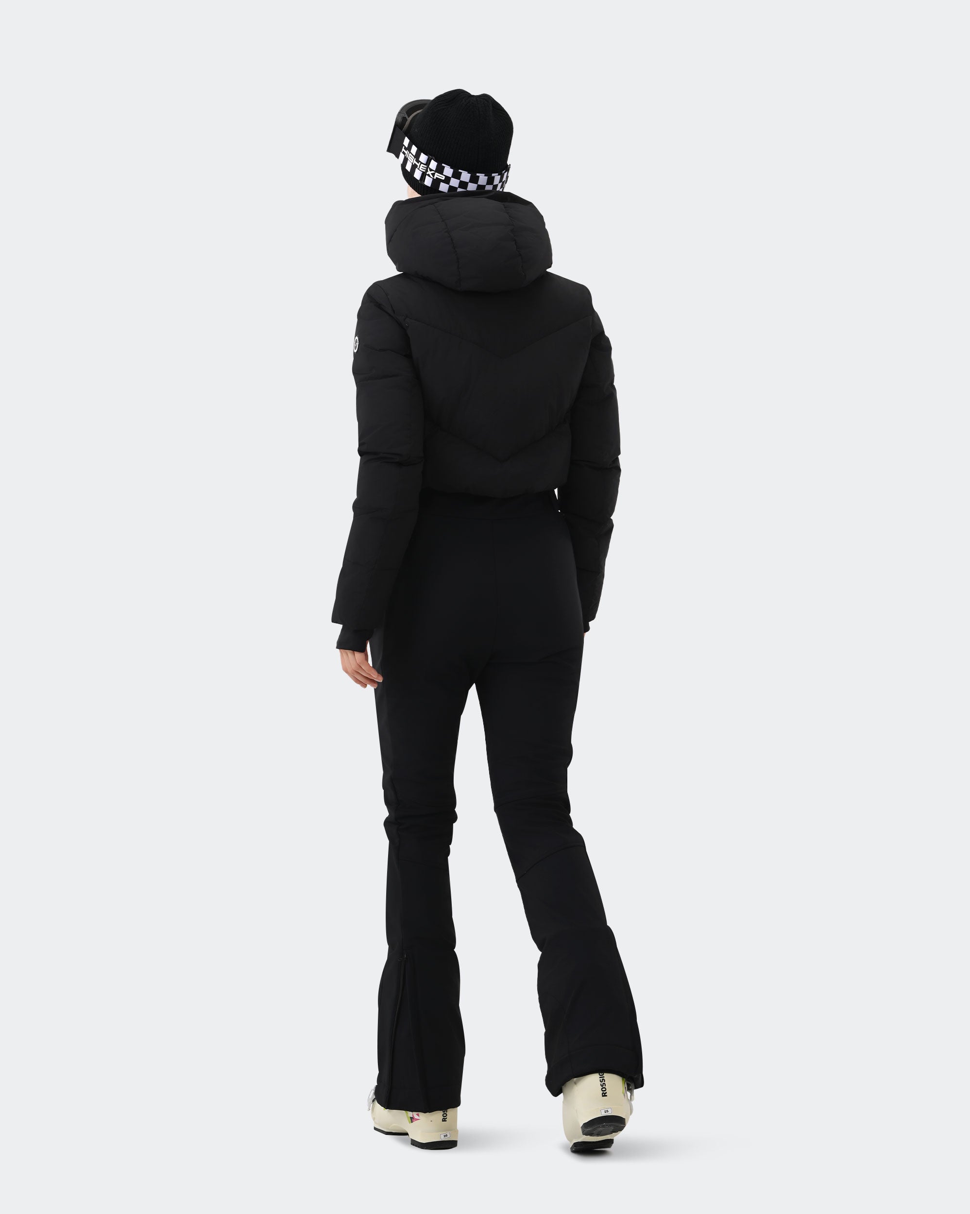 Women's Black insulated snowsuit side view showing slim fit silhouette
