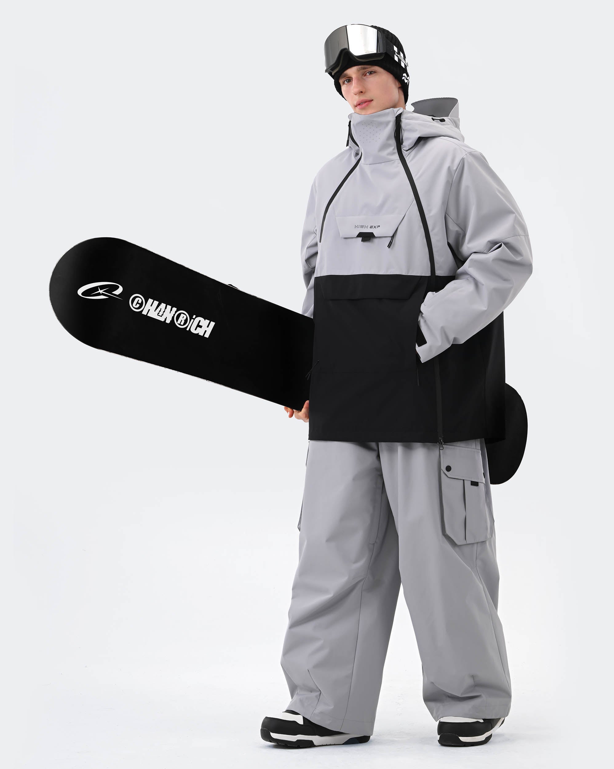 Gray ski jacket cuff lift ticket pocket and zippered chest pocket detail
