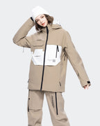 Light Khaki ski jacket goggle pocket and snow skirt detail
