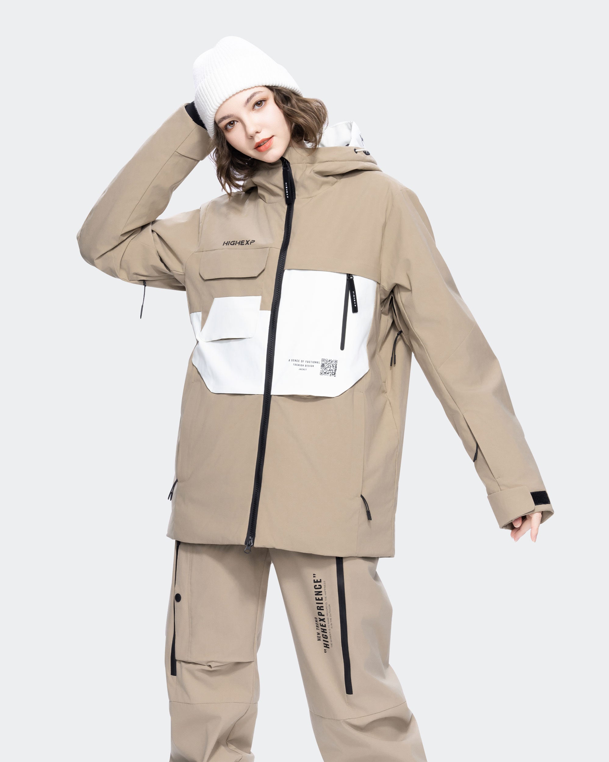 Light Khaki ski jacket goggle pocket and snow skirt detail
