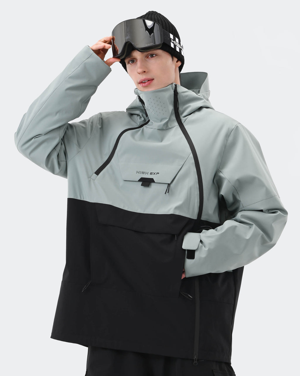 Greenish Blue Black anorak ski jacket side profile showing windproof construction

