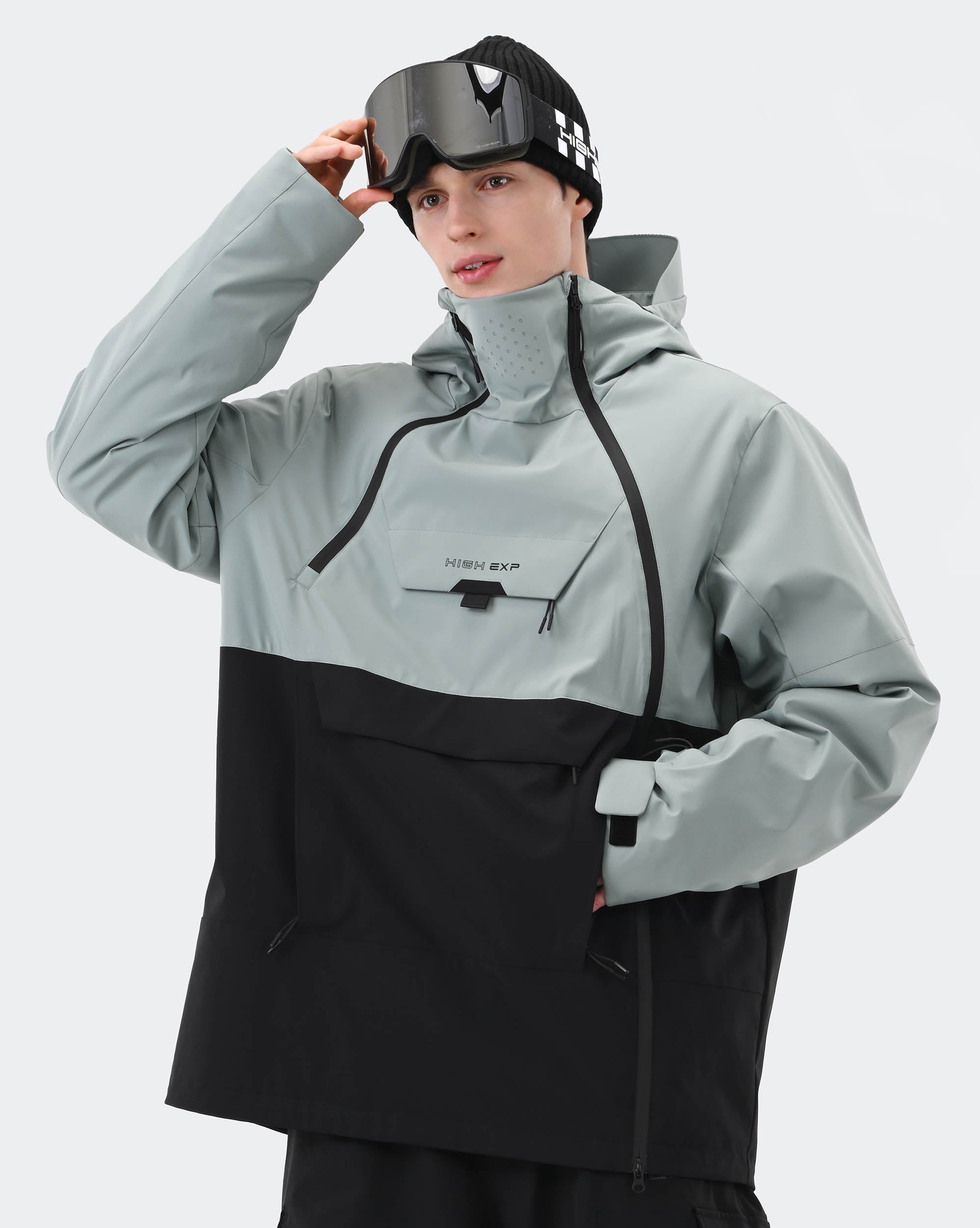 Greenish Blue Black anorak ski jacket side profile showing windproof construction
