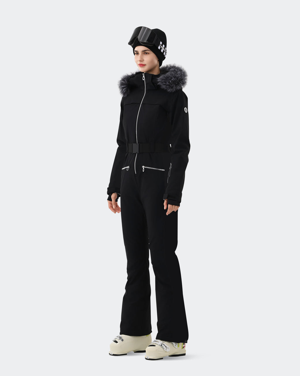 Black one-piece ski suit side view showing slim waist belt and finger hole cuffs

