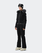 Black one-piece ski suit side view showing slim waist belt and finger hole cuffs
