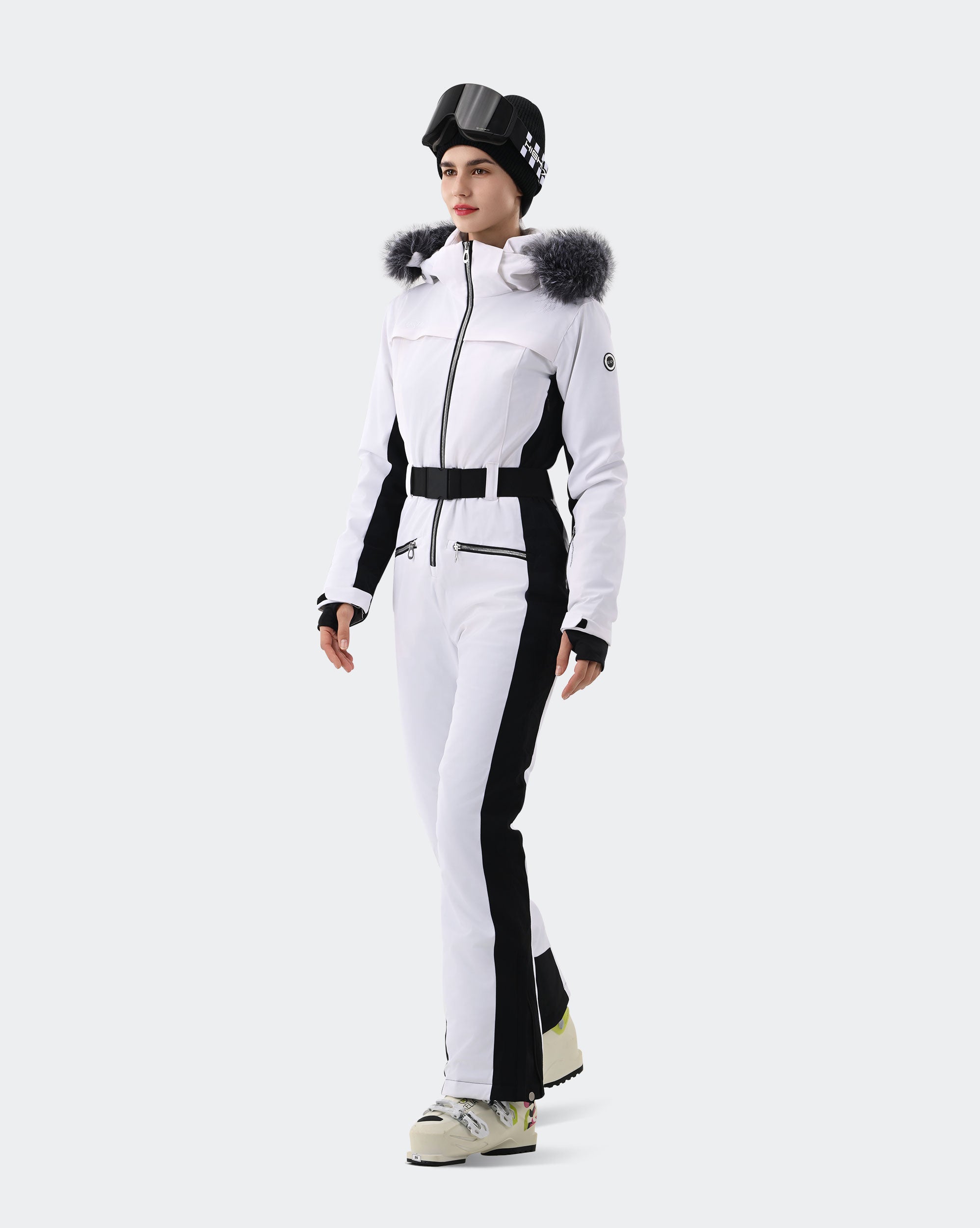 White one-piece ski suit side view showing slim waist belt and finger hole cuffs
