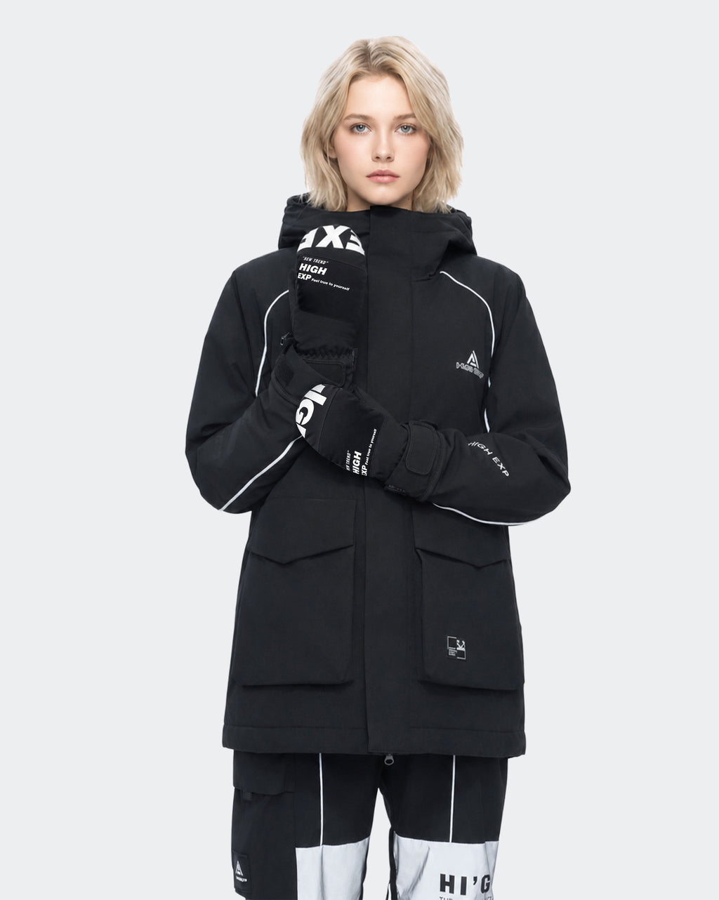 High Experience Black Ski Gloves - Female Model in Black Ski Outfit, Side Angle
