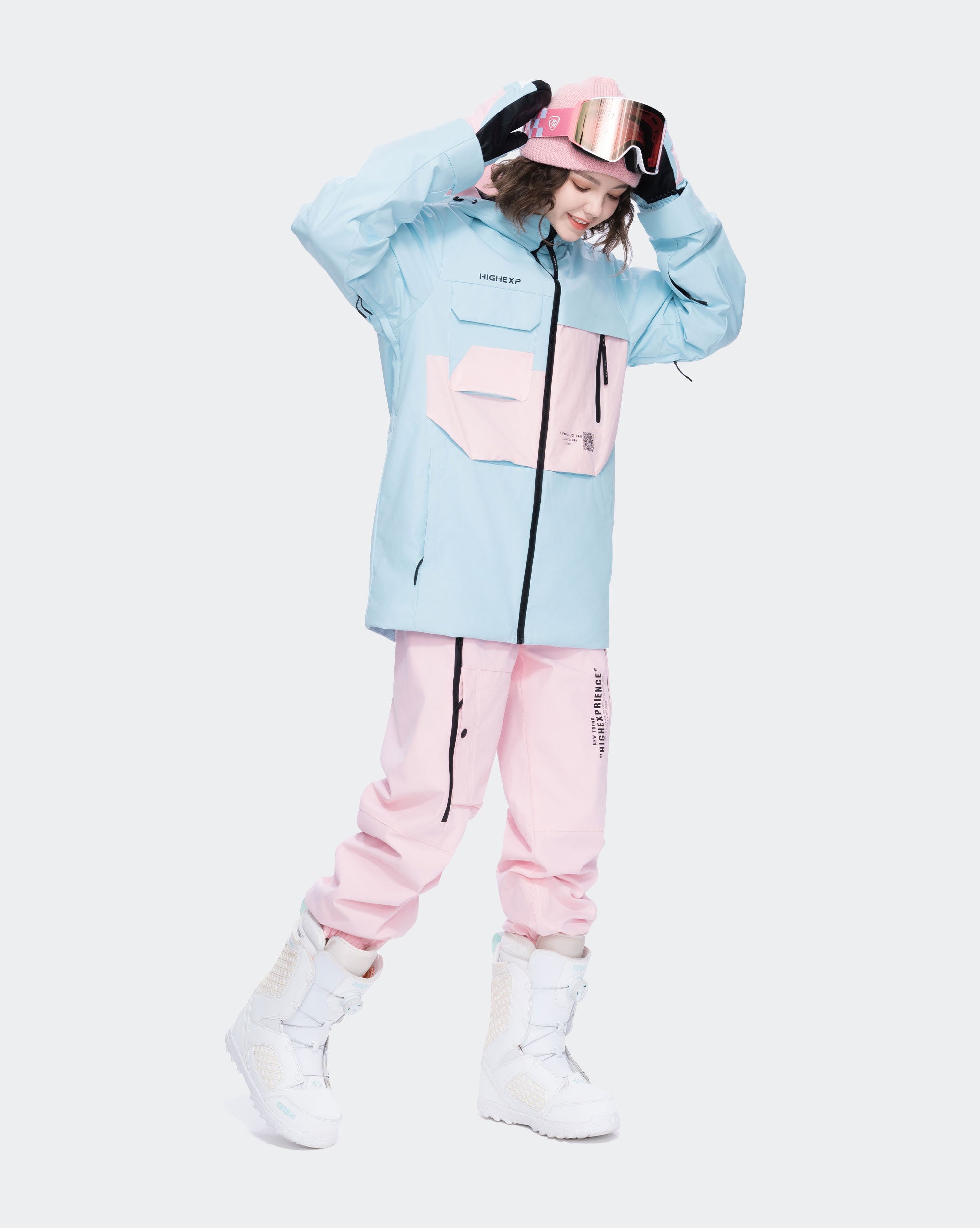 Blue ski jacket underarm ventilation and waterproof pocket detail
