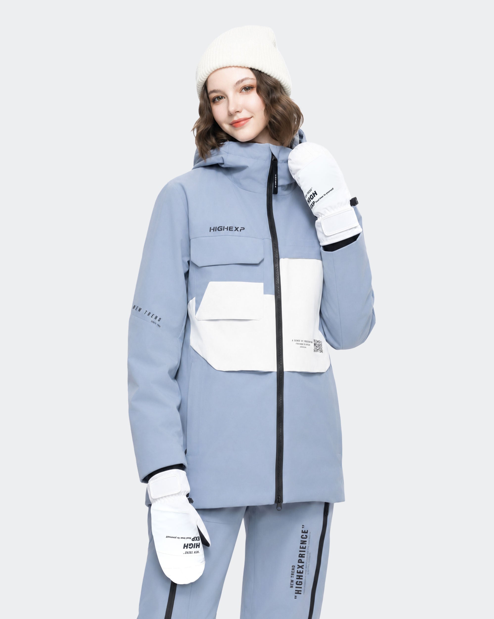 High Experience Black White Ski Gloves - Female Model in Grey Blue Ski Outfit, Side Angle