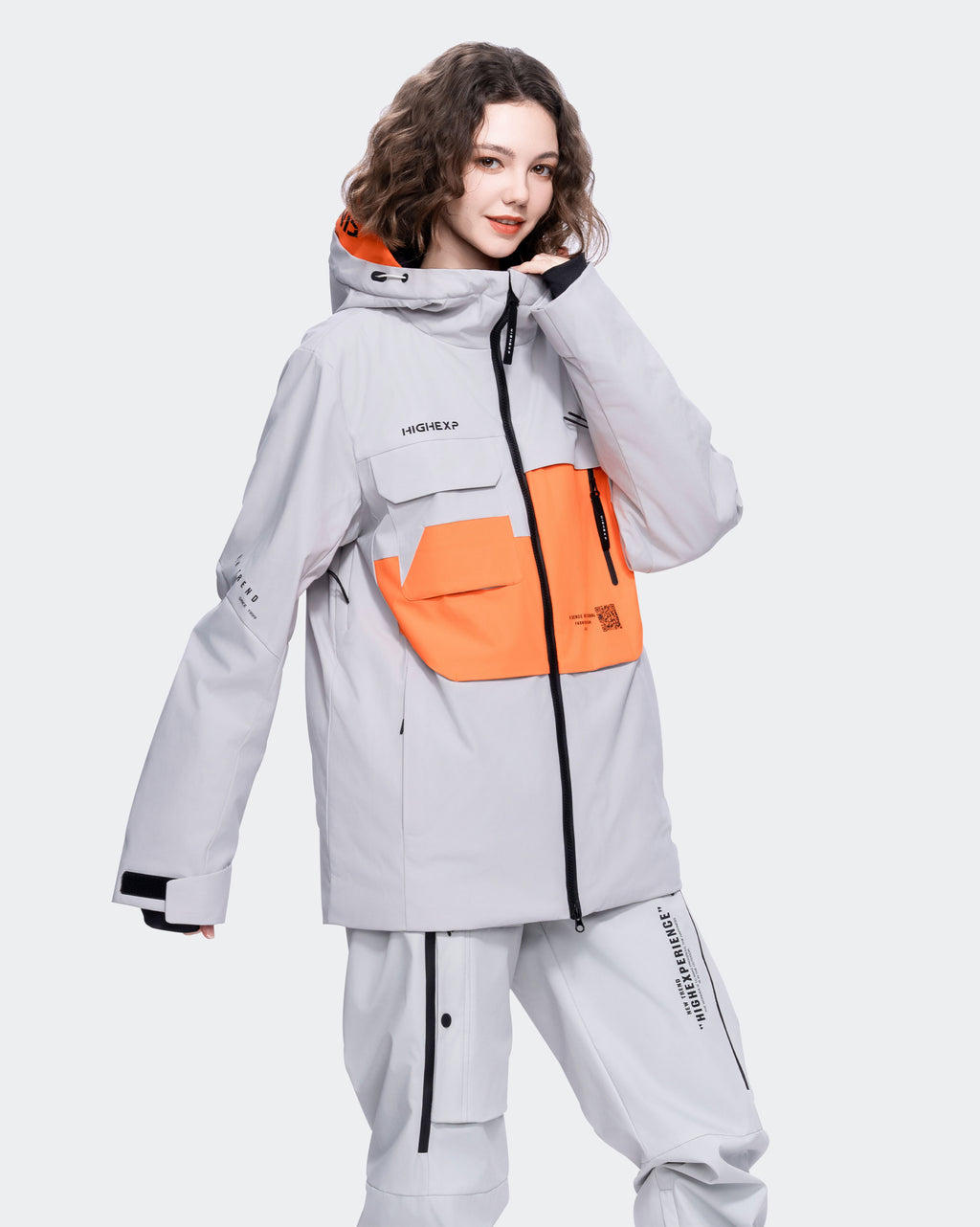 Gray ski jacket side profile showing layering fit
