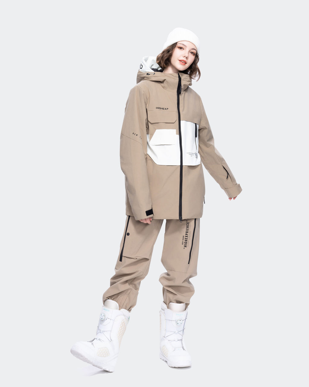 Women wearing Light Khaki waterproof ski jacket in snow
