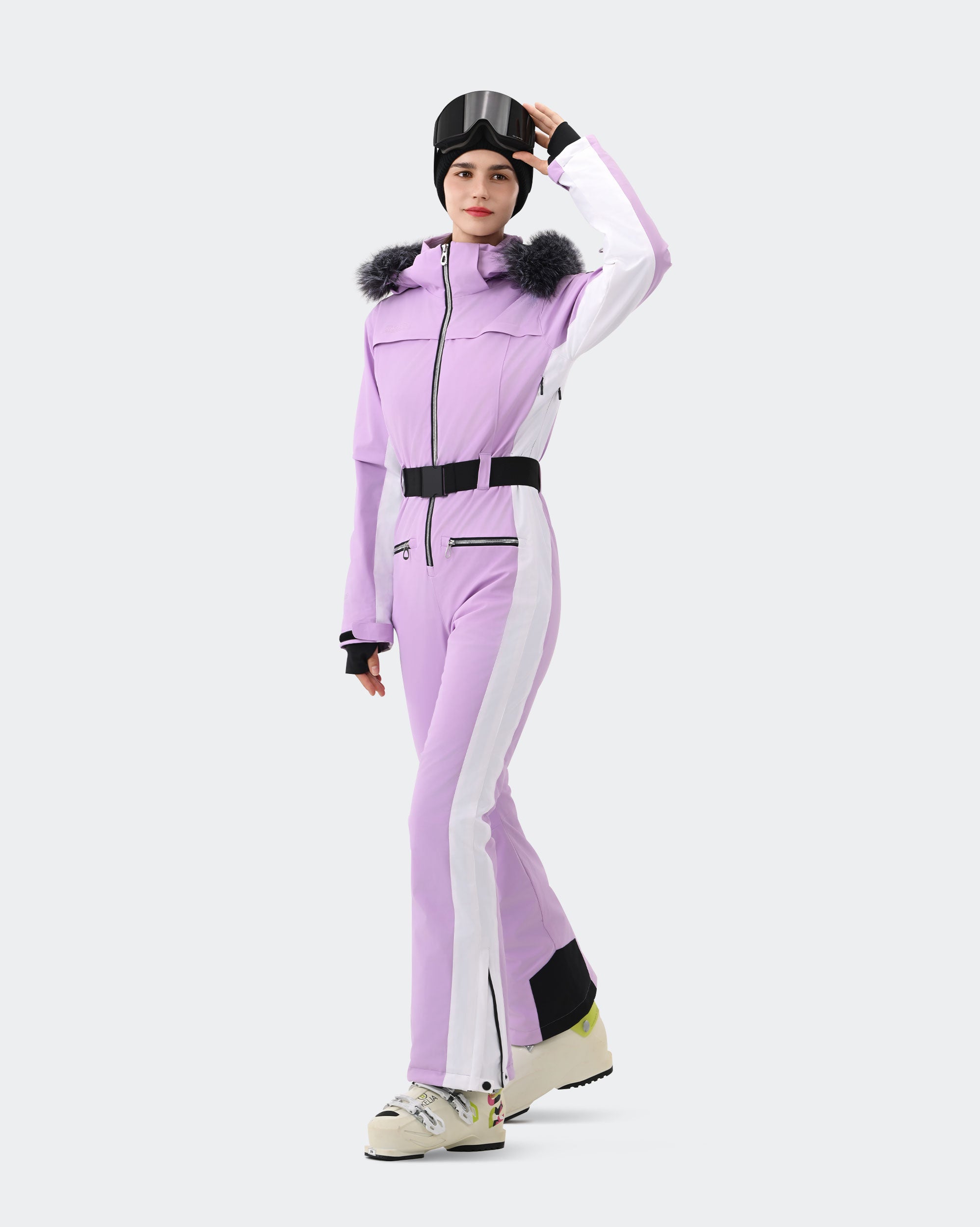 Women wearing Light Purple one-piece insulated ski suit winter outdoor shot
