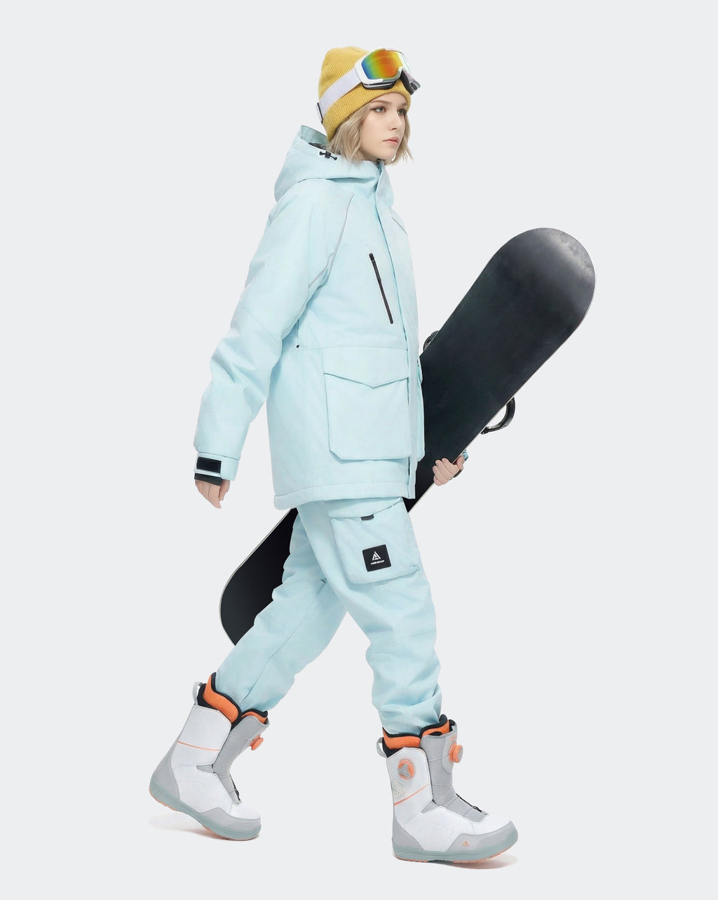 Light Blue ski jacket inner security pocket and snow skirt detail
