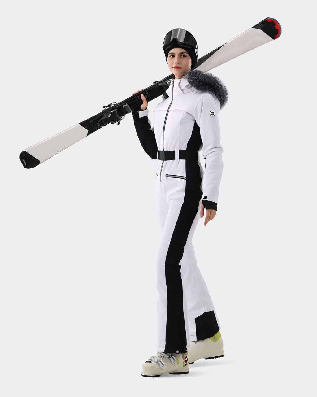 Women wearing White one-piece insulated ski suit on mountain
