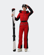 Women wearing Red and Black one-piece insulated ski suit powder day

