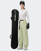 HIGH EXPERIENCE Women's Baggy Ski Pants Olive Green On Model Front — Waterproof Snowboard Pants