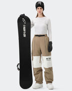 HIGH EXPERIENCE Women's Baggy Ski Pants Khaki On Model with Board — Insulated Snow Pants