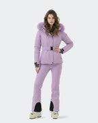 Women wearing Light Purple slim fit ski jacket on groomed run
