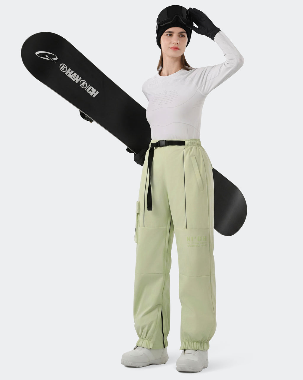 HIGH EXPERIENCE Women's Baggy Ski Pants Olive Green On Model with Board — Waterproof Ski Pants