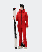 Woman wearing Red one-piece insulated ski suit on ski slope
