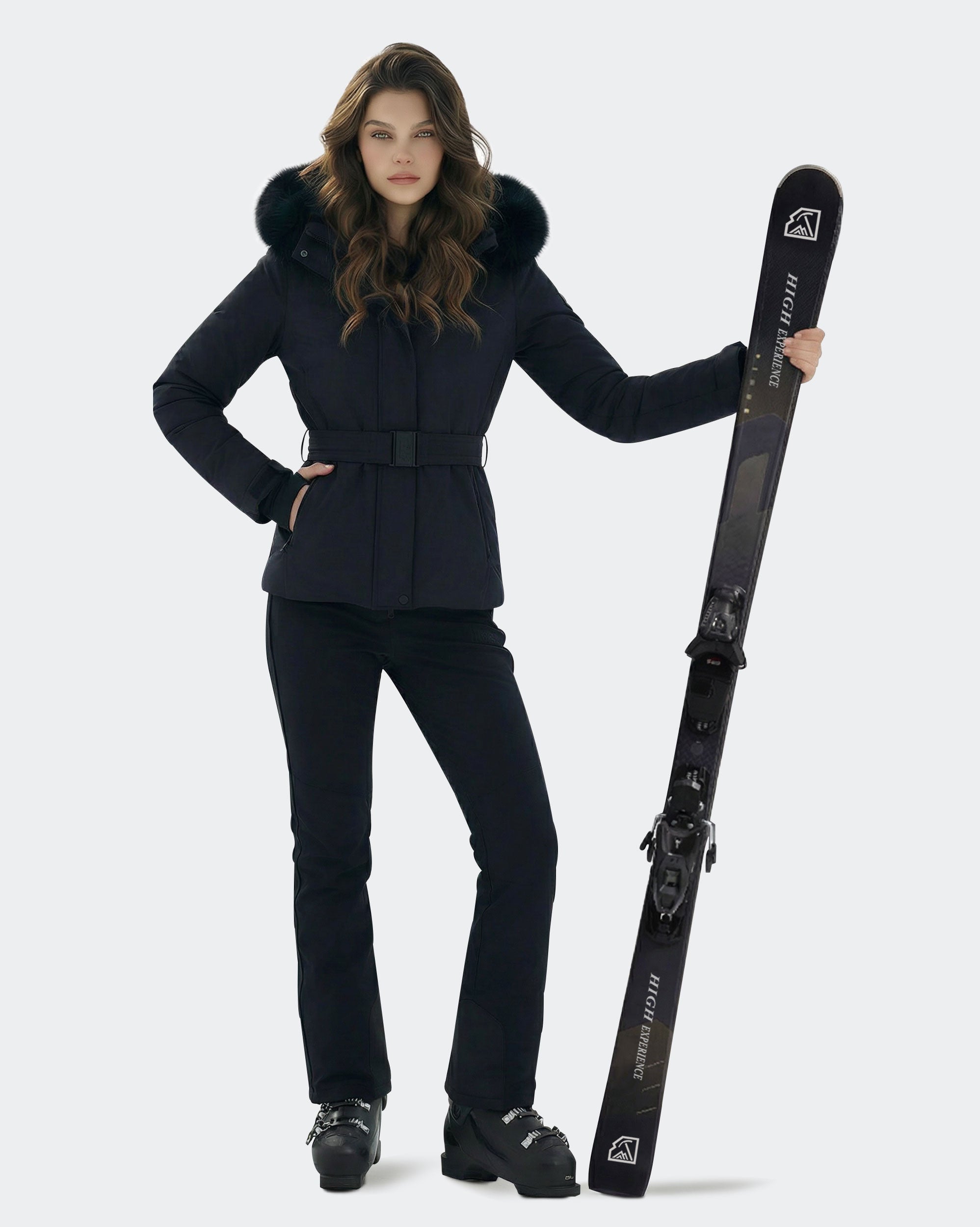 Women wearing Black slim fit belted ski jacket on mountain
