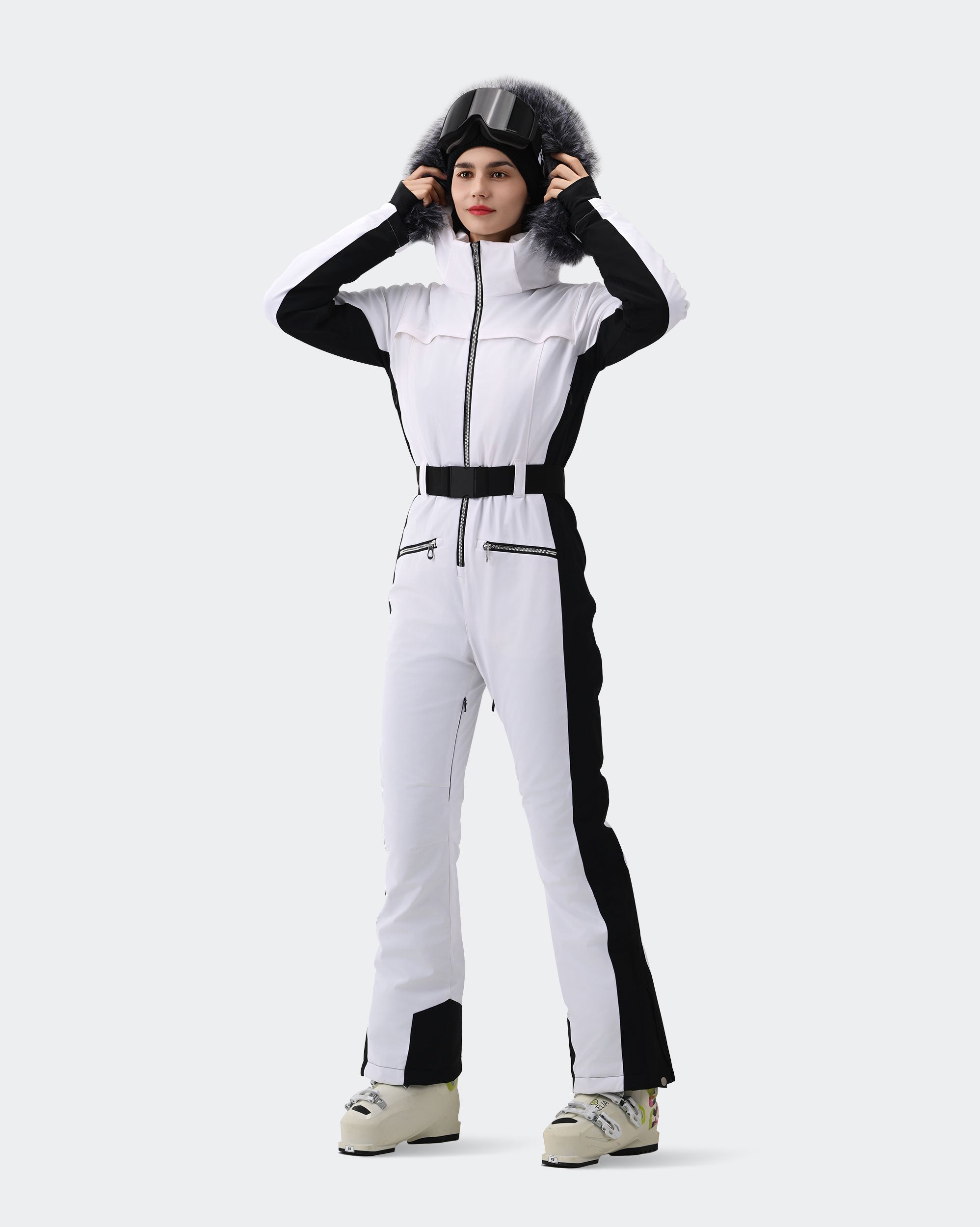 White ski suit removable hood, fur collar and goggle pocket detail
