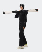 Women wearing Black one-piece insulated ski suit on mountain
