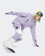 Women wearing Light Purple waterproof ski jacket in snow
