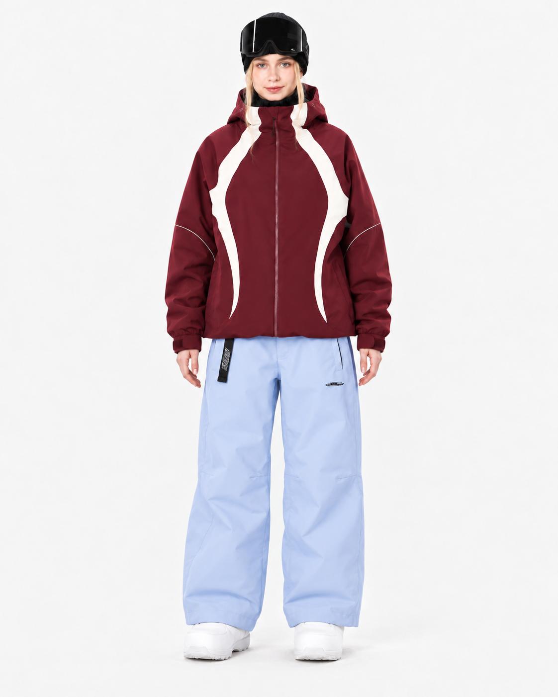 Model wearing a burgundy jacket and light blue pants