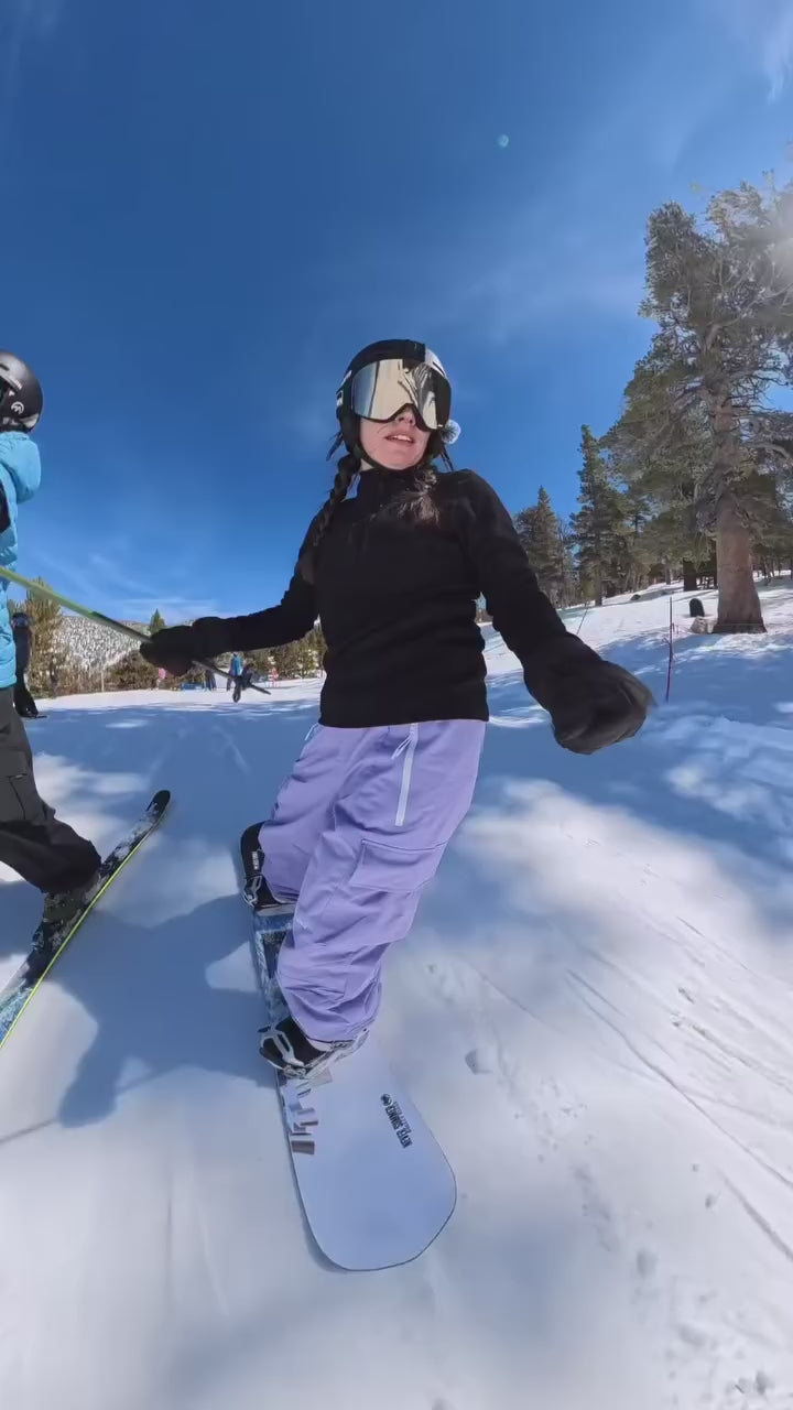 HIGH EXPERIENCE purple snowboard pants in the terrain park